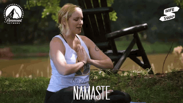 a woman sits on a yoga mat in front of a paramount network chair