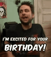 a man is sitting in front of a door and says i 'm excited for your birthday !