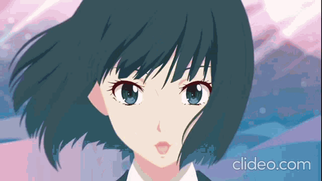 a close up of a girl 's face with the website clideo.com in the background