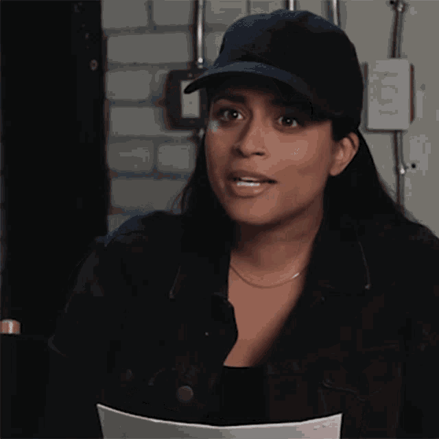 a woman wearing a hat says thank you so much in black letters