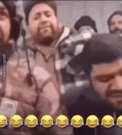 a group of men are laughing and crying in a video