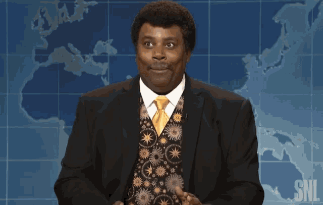 a man in a suit and tie is on snl