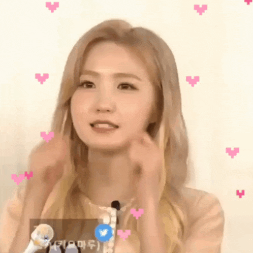 a girl with blonde hair and pink hearts around her face