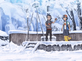 two boys are standing in the snow talking to each other in a snowy area .