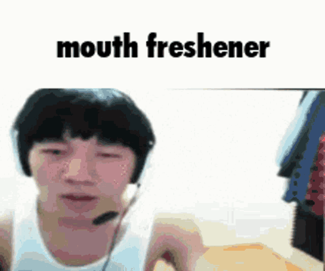 a man wearing headphones and a mouth freshener