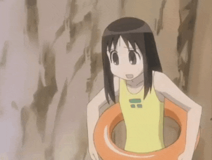 a girl in a yellow tank top is holding an orange life preserver ..