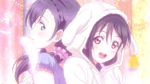 two anime girls are standing next to each other with one wearing a bunny hoodie