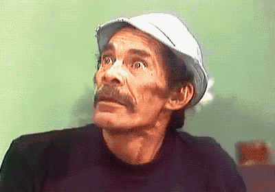 a man with a mustache wearing a white hat and black shirt