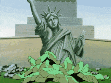 a statue of liberty is surrounded by a pile of rocks