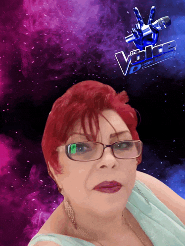 a woman with red hair and glasses is standing in front of a poster for the voice
