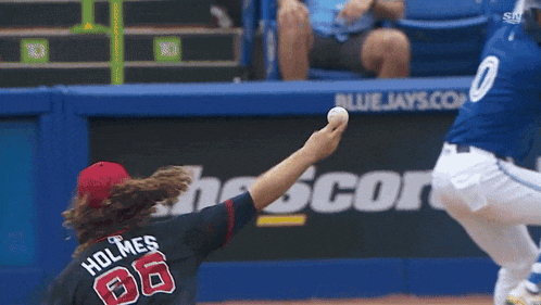 a baseball player with the name holmes on the back of his shirt