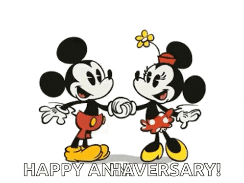 mickey mouse and minnie mouse are kissing and holding hands in a happy anniversary greeting card .