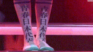a person with chinese writing on their legs