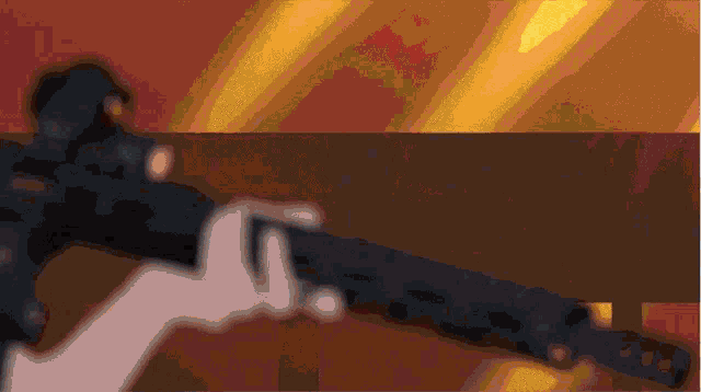 a blurry picture of a person holding a gun with a yellow background