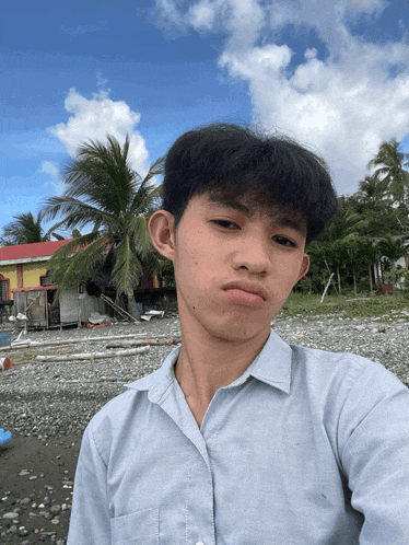a young man taking a selfie in front of a building