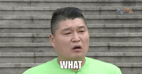 a man in a green shirt is making a funny face and saying what
