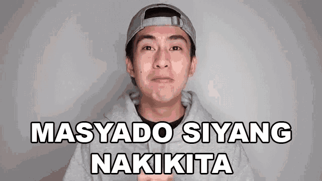 a young man wearing a baseball cap and a grey hoodie says masado siyang nakita