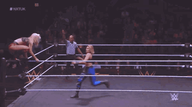 a wrestler 's butt is shown during a wrestling match on nxtuk