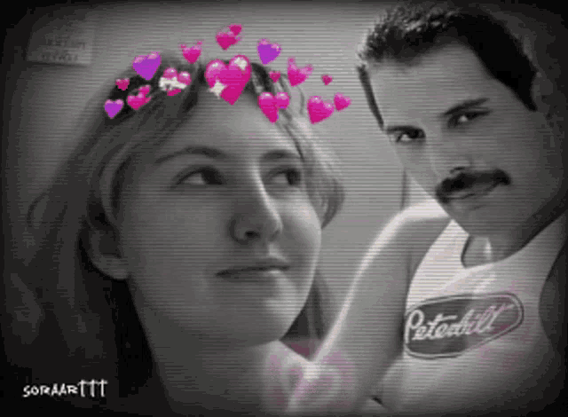 a black and white photo of a man and a woman with hearts on their head