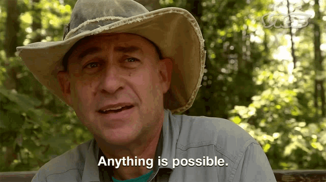 a man in a cowboy hat is saying anything is possible