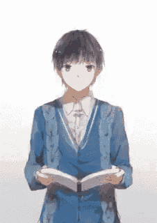 a boy in a blue jacket is reading a book .