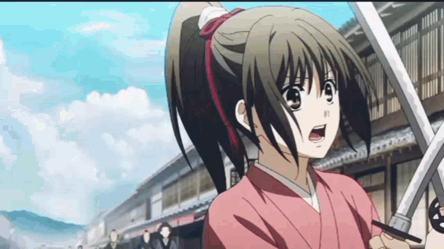 a girl in a pink kimono is holding two swords in front of a building