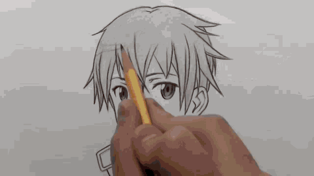 a person is drawing a person with a pencil on a piece of paper .
