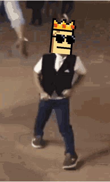 a boy with a crown on his head and sunglasses is dancing