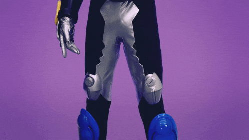 a person in a purple costume with a red belt