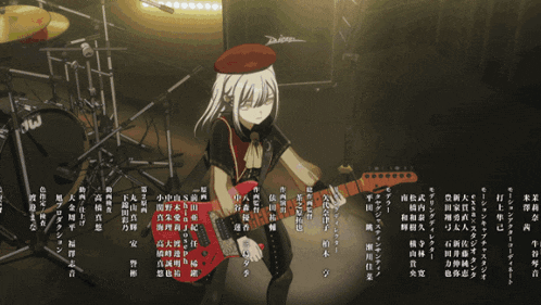 a woman in a red hat stands in front of a drum set with chinese writing on it