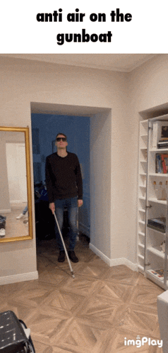 a man with a cane is standing in a hallway with the words anti air on the gunboat below him