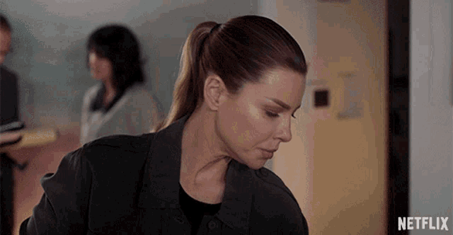 a netflix ad shows a woman in a black jacket