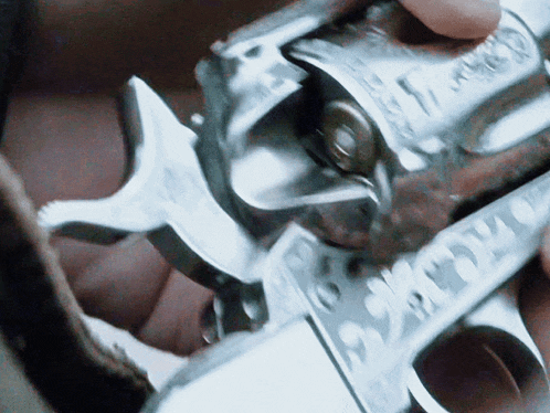 a close up of a person holding a gun that says ' smith & wesson ' on the barrel