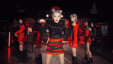 a group of dancers are dancing in front of a sign that says no turn on red