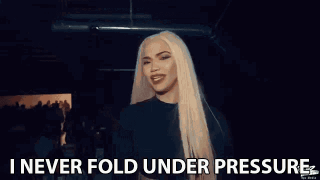 a woman is holding a bunch of money in her hand and says `` i never fold under pressure '' .