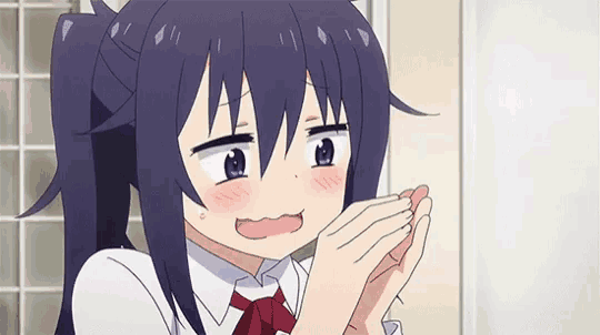 a girl with purple hair and a red bow tie is making a funny face