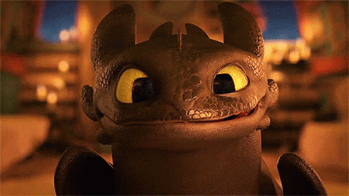 a toothless from how to train your dragon is smiling for the camera