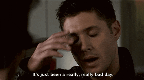 a man holds his hand to his forehead with the words it 's just been a really really bad day below him