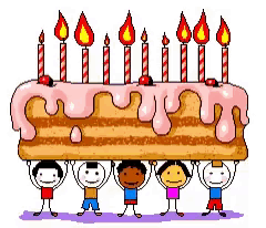 children holding up a birthday cake with candles on it