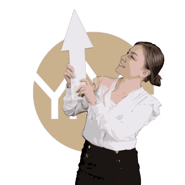 a woman in a white shirt is holding up a white arrow pointing up