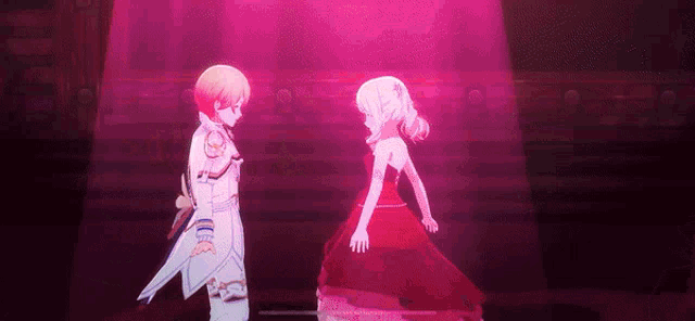 a boy and a girl are standing next to each other on a stage .