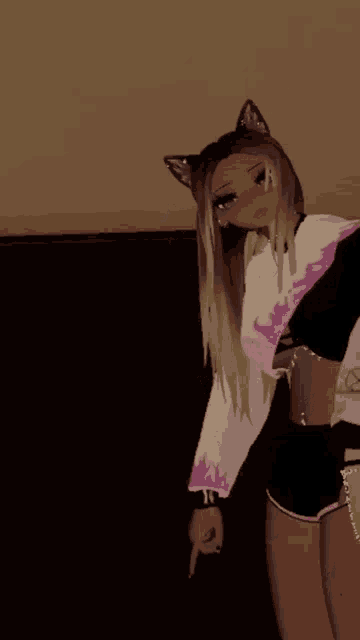 a girl with cat ears on her head is standing next to a bed .