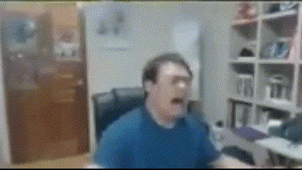 a blurry picture of a man in a blue shirt