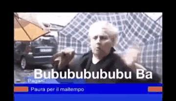 a tv screen shows a man holding an umbrella and the words bubububububu ba