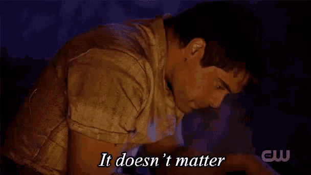 a man is sitting in front of a fire and says it does n't matter