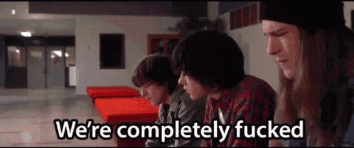 three young men are sitting in a hallway with the words we 're completely fucked
