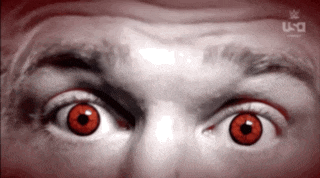a close up of a man 's face with red eyes and a logo for ufc