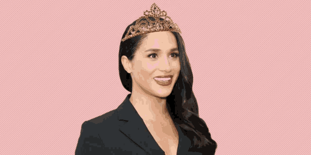 a woman wearing a tiara and a black jacket is smiling .
