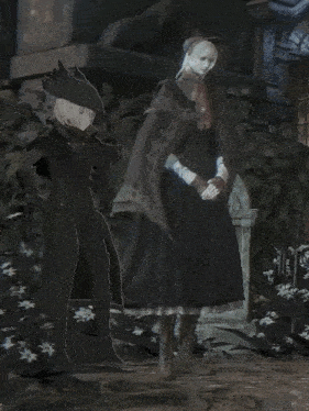 a man and a woman are standing next to each other in a dark room