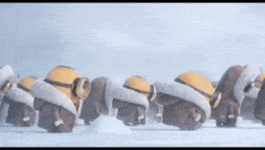 a group of minions wearing fur hats and goggles are walking in the snow